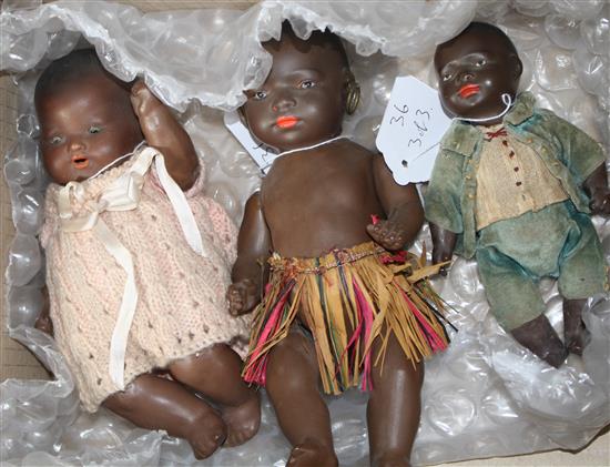 An AM 351 black baby, jointed body, 8in., a Heubach black doll, 9in., paint loss on neck and a Heubach black baby, 6in. (3)